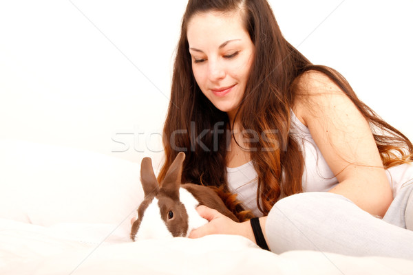 Caressing a rabbit in bed					 Stock photo © Spectral