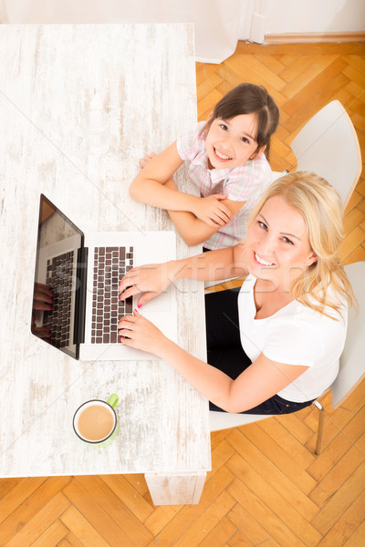Mother and Daughter with a Laptop at home Stock photo © Spectral