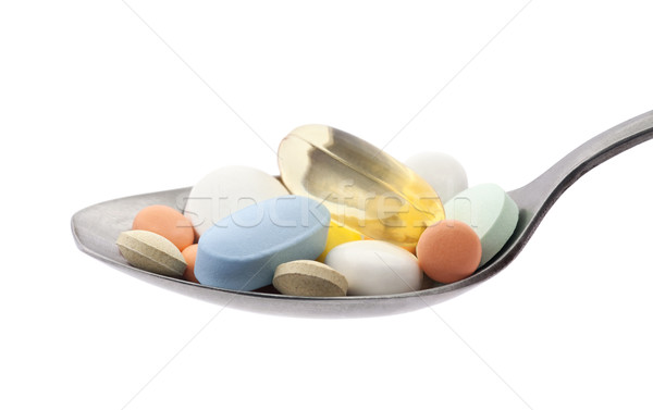 Pills on spoon with clipping path Stock photo © sqback
