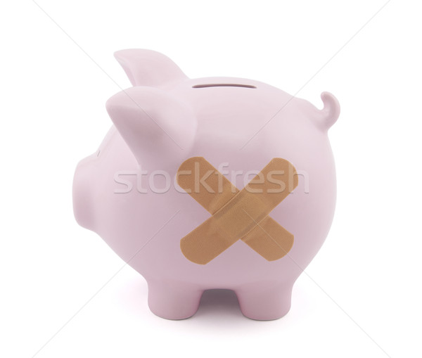 Piggy bank with plaster. Clipping path included. Stock photo © sqback