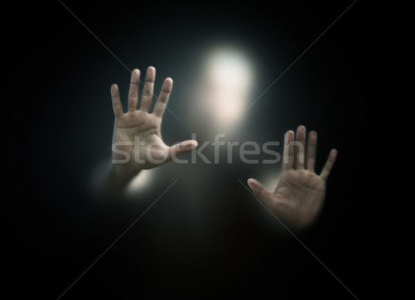 Shadowy figure behind a dusty scratched glass  Stock photo © sqback