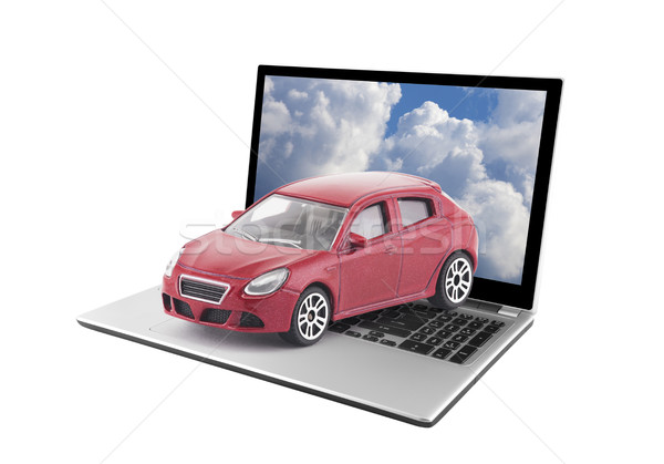 Toy car on laptop isolated on white background  Stock photo © sqback