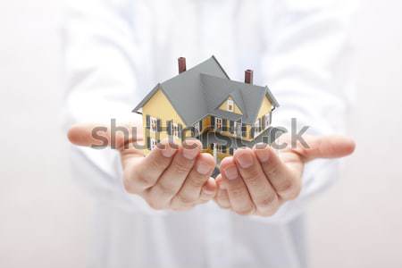 Blue house in hands. Home insurance concept.  Stock photo © sqback