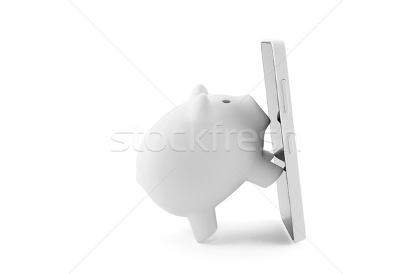 White piggy bank with mobile phone Stock photo © sqback