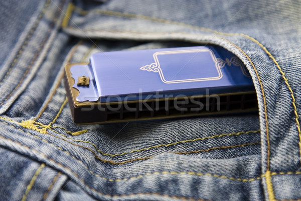 Blue harmonica in pocket Stock photo © sqback