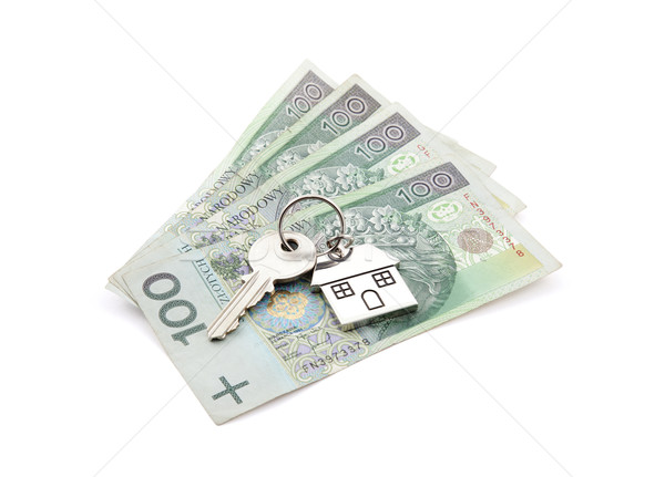 House key on pile of polish banknotes Stock photo © sqback