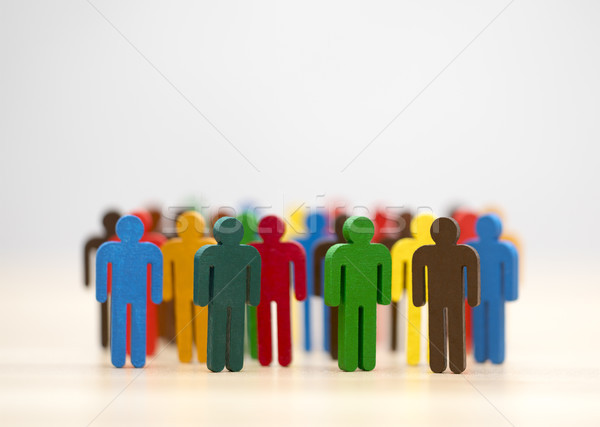Stock photo: Colorful painted group of people figures 