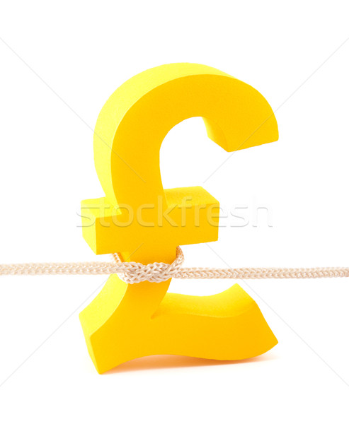 Golden pound symbol tied with rope Stock photo © sqback