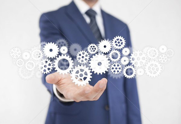 Businessman with gears, concept of well organized work process.  Stock photo © sqback