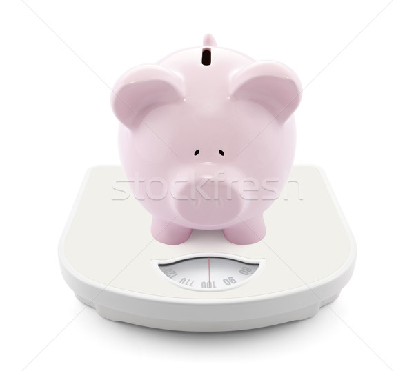 Piggy bank on scales Stock photo © sqback
