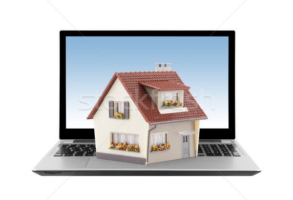 Stock photo: House on laptop isolated on white 