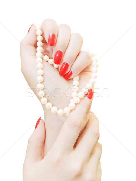 Manos mujer uñas de color rojo perlas blanco belleza Foto stock © SRNR