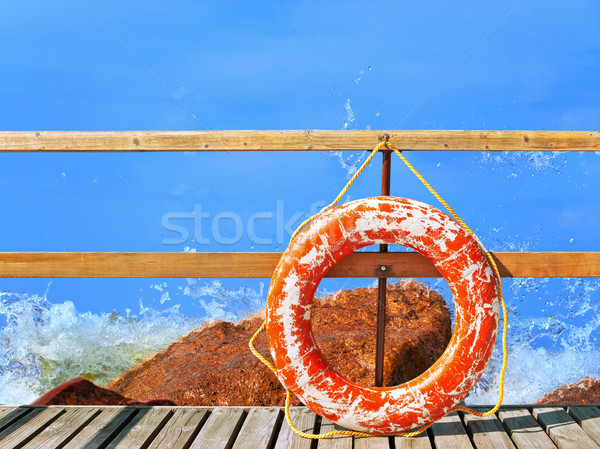 sea and pier with life buoy Stock photo © SRNR