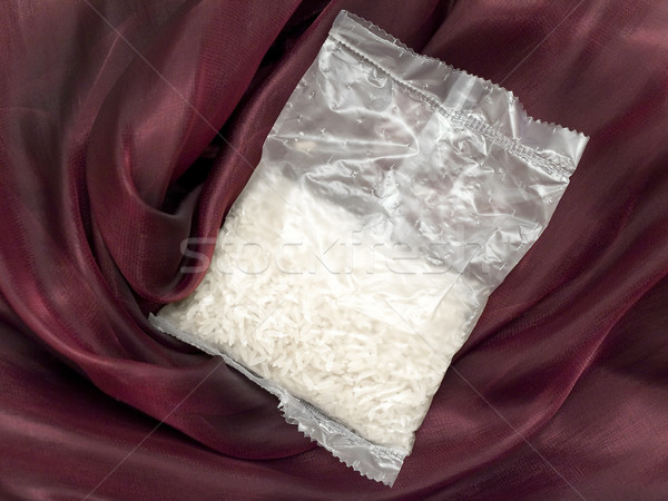 White rice pack at the burgundy textile Stock photo © SRNR