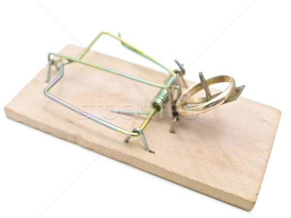 Single mousetrap with golden ring against the white background  Stock photo © SRNR