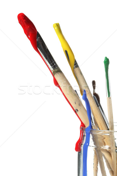 Paint brushes covered in paint Stock photo © SSilver
