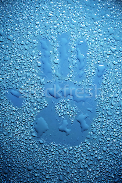 Handprint in water drops Stock photo © SSilver