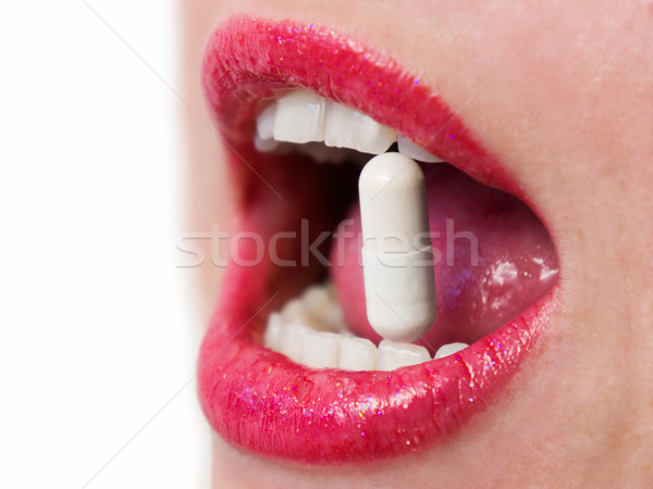 Kapsułka młodych kobiet pigułki usta kobiet Zdjęcia stock © Steevy84