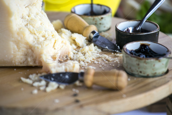 Pieces of italian parmesan cheese with cherry jam Stock photo © stefanoventuri