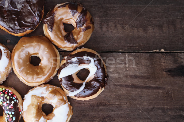 Donut Over Rustic Barn Wood Background Stock photo © StephanieFrey