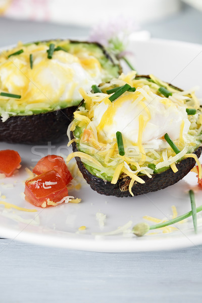 Eggs Baked in Avocado with Cheese Stock photo © StephanieFrey