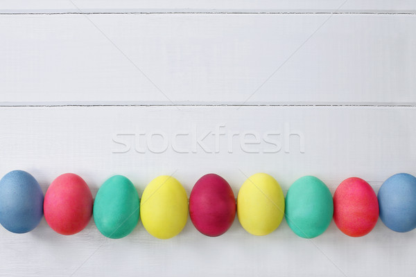 Foto stock: Huevos · de · Pascua · mesa · de · madera · superior · vista · colorido · Pascua