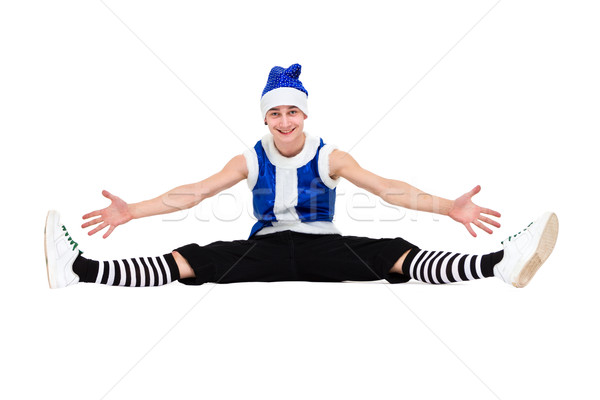 Stock photo: actor dressed like a funny leprechaun makes splits