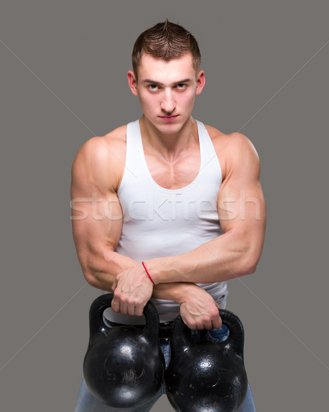 Férfi testmozgás súlyzós edzés edzés fitnessz egy Stock fotó © stepstock