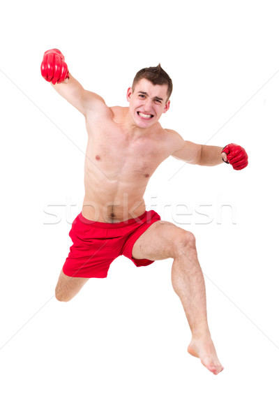 Jonge vechter springen geïsoleerd witte man Stockfoto © stepstock