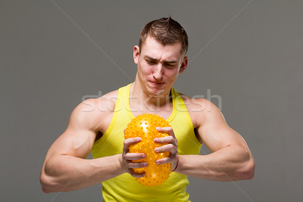 Muscolare giovane braccio muscoli grigio uomo Foto d'archivio © stepstock