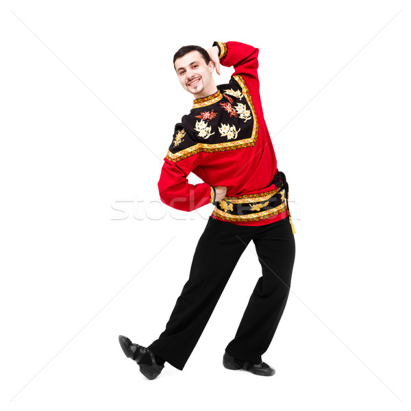 Attractive man wearing a folk russian costume dancing Stock photo © stepstock