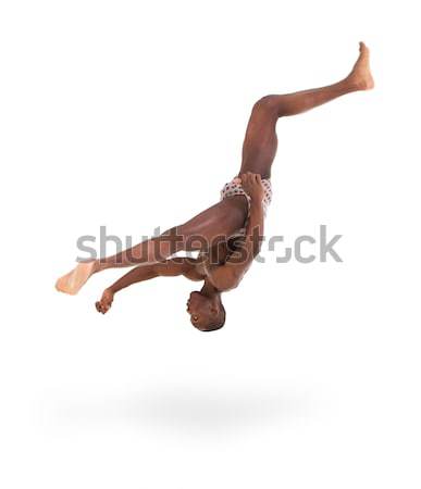 muscular man jumping Stock photo © stepstock