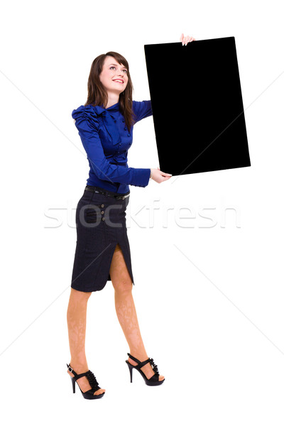 Stock photo: young woman holding a blank board
