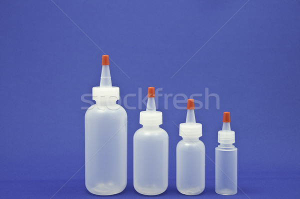 Vertikalen Flaschen vier blau alle unterschiedlich Stock foto © stockfrank