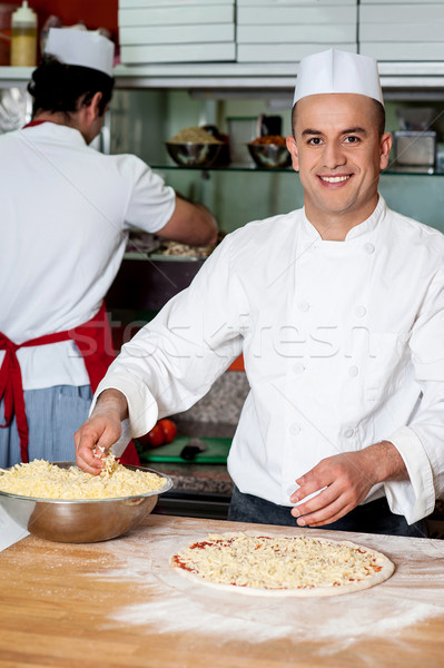 Maschio lavoro cucina chef formaggio grattugiato Foto d'archivio © stockyimages