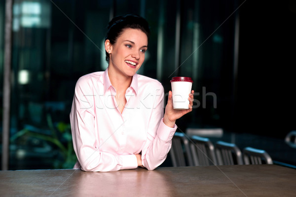 Pretty lady enjoying chilled liquid refreshment Stock photo © stockyimages