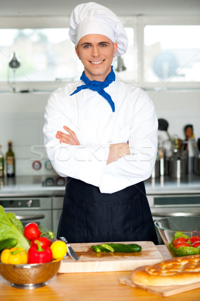 Male chef chopping vegetables in table Stock photo © stockyimages