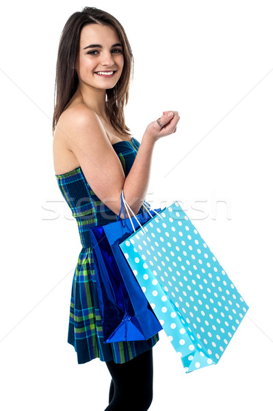 Sideways of shopping teen girl.  Stock photo © stockyimages