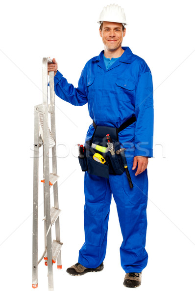 Repairman with a stepladder and tools bag Stock photo © stockyimages