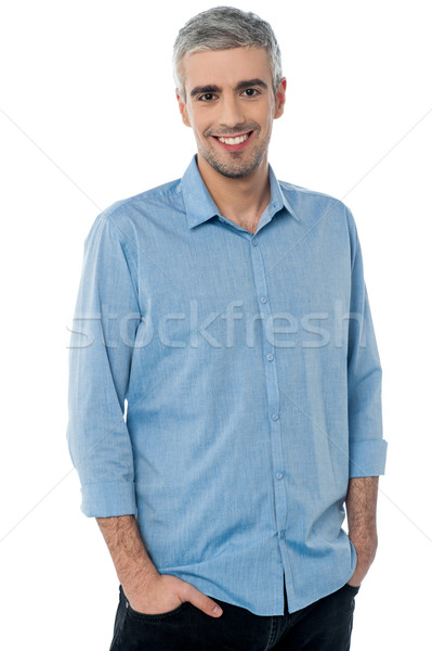 Casual shot of smiling businessman Stock photo © stockyimages