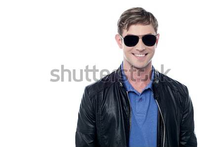 Handsome young man in a leather jacket Stock photo © stockyimages