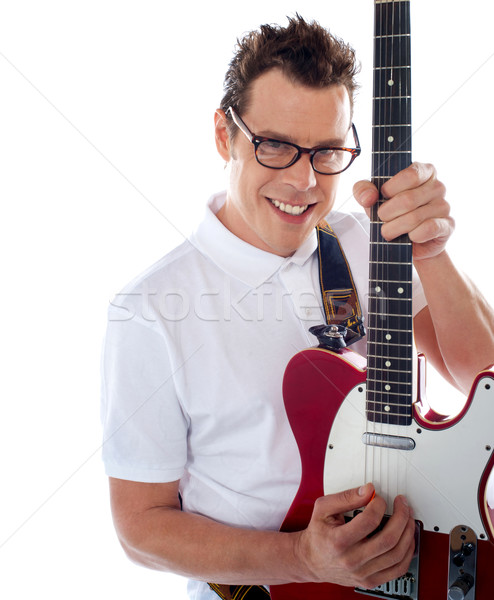 Stock photo: Closeup of a male guitarist