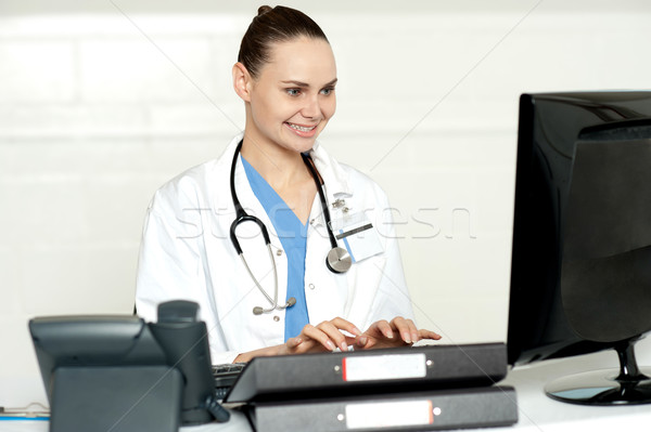 Medical professional working on computer Stock photo © stockyimages