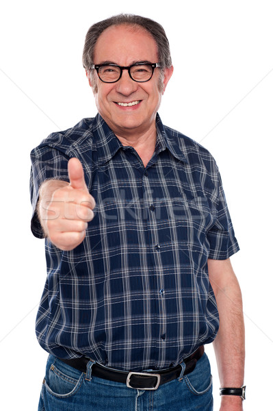 Aged man gesturing thumbs up Stock photo © stockyimages