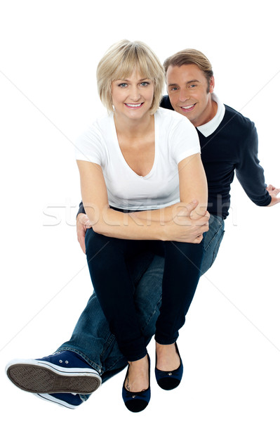 Middle aged lady sitting on her man's lap Stock photo © stockyimages
