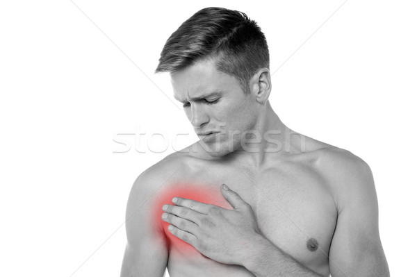 Junger Mann Brust Schmerzen Leiden Mann Körper Stock foto © stockyimages