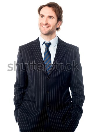 Smart businessman posing casually Stock photo © stockyimages