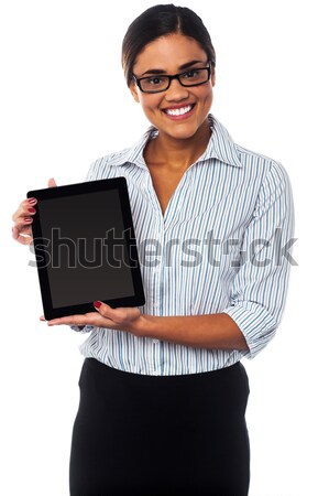 Confident female secretary submitting her binder Stock photo © stockyimages