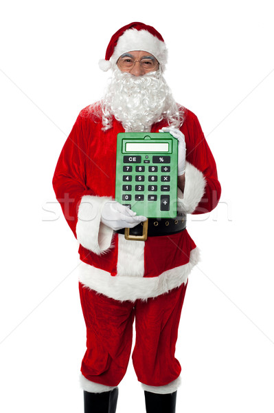 Old man dressed as Santa showing a large green calculator Stock photo © stockyimages