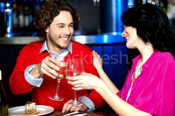 Stock photo: Cheers! Couple celebrating their love together